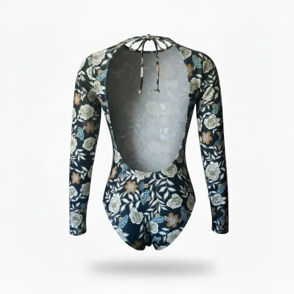 Modern Ocean Γυναικείο  ολόσωμο μακρυμάνικο μαγιό ιδανικό για σέρφ με flower pattern σε χρωμα σκουρο μπλε και κιτρινοχρυσες λεπτομέρειες