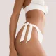 Triumph Γυναικείο μαγιό δετό σλιπ με ρυθμιζόμενα πλαινά λευκό ανάγλυφο Summer Dune TAI 10226481.3799/1K
